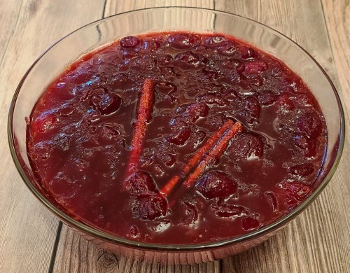 Cranberry sauce with cinnamon sticks in serving bowl