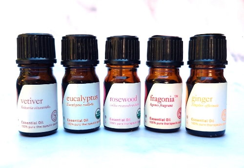 Bottles of Vetiver, Eucalyptus, Rosewood, Fragonia, and Ginger essential oils.