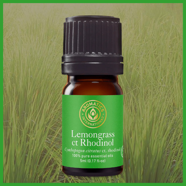 Lemongrass essential oil bottle with green label on a grassy background 5 ml
