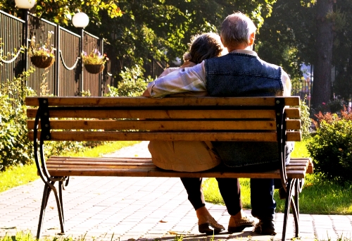 Couple on park bench representing Himalayan Cedarwood and Patchouli essential oils.