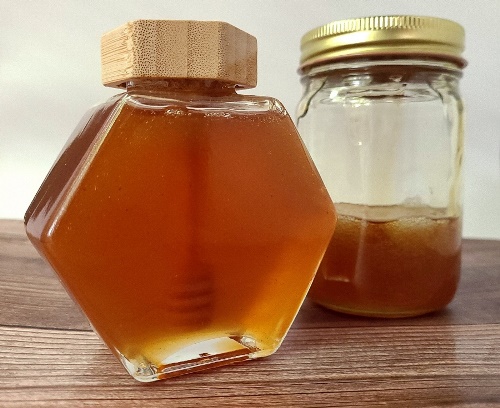 Two jars of herbal honey.