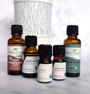 Stress Less Back to School Aromatherapy blend's essential oils and diffuser