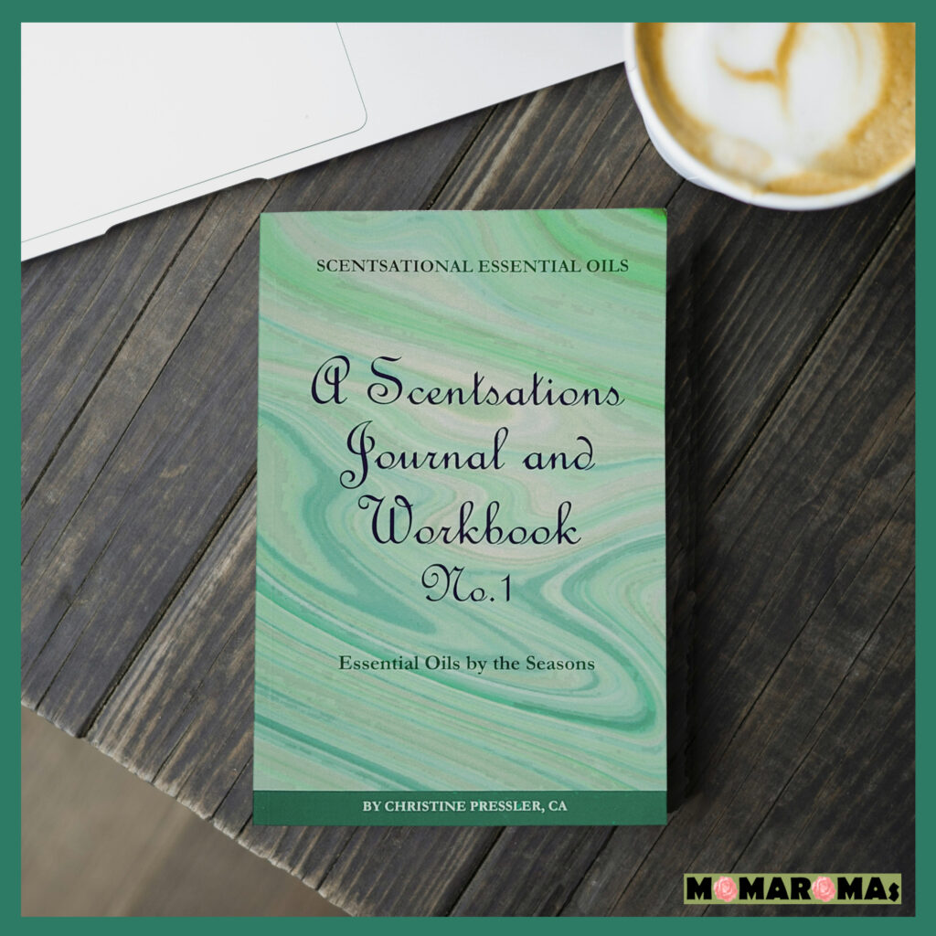 SEO_JournalDesk - MOMAROMAs: Your Guide to Aromatherapy, DIY Essential Oils, and Natural Wellness Scentsations Essential Oil Journal and Workbook on a desk