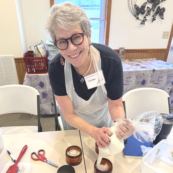 Making Body Butter Liz Fulcher filling jars with handcrafted cream